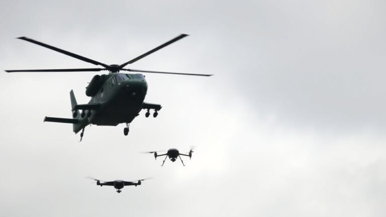 German military helicopter targets a drone in the sky.