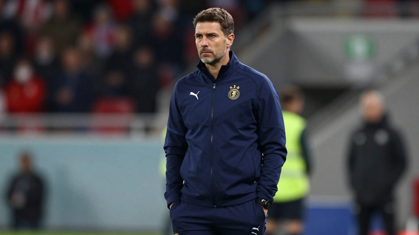 Motherwell manager on a football pitch.