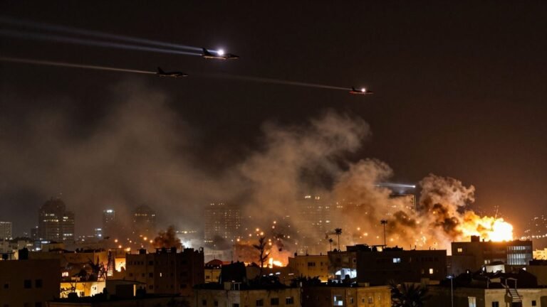 Explosions over city skyline with fighter jets.