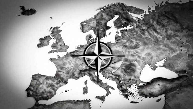 Fractured NATO emblem on a shadowy world map.