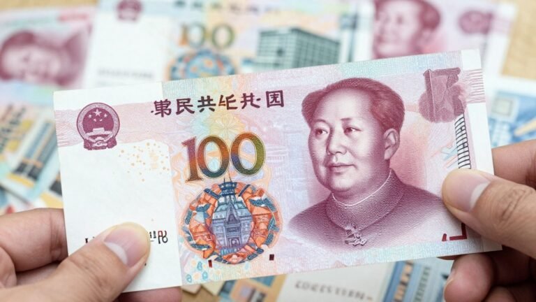 Chinese Yuan banknote and cityscape