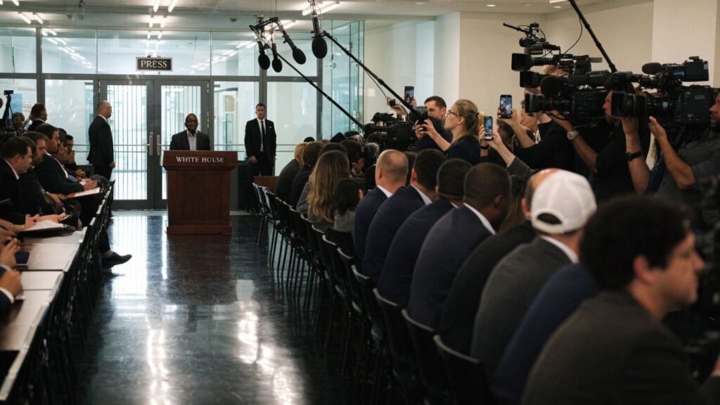 Reporters and cameras gather inside a tense White House press room.